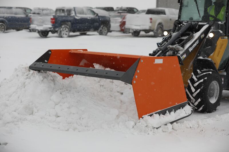 Snow pusher attachment