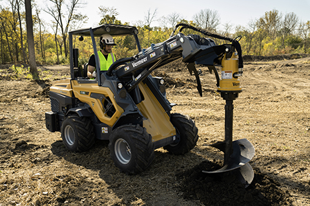 ATX creating a hole in the ground with an auger